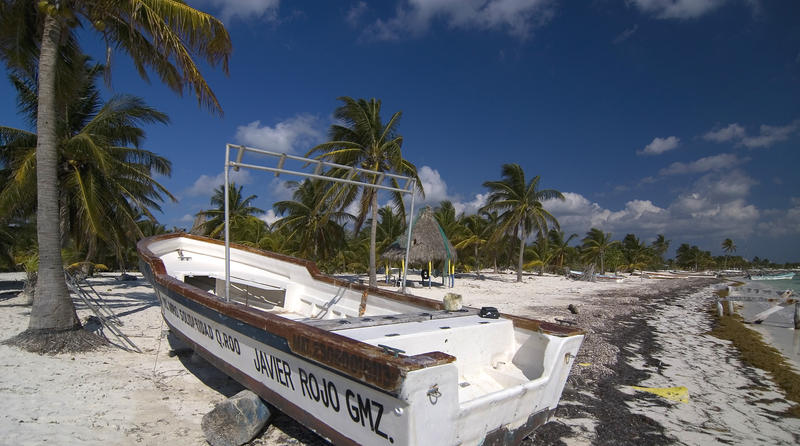 A fishing boat beached at Punta Allen, Mexico,